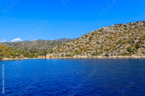 Boats moored at rocky shore of the Mediterranean Sea near Simena in Antalya province, Turkey