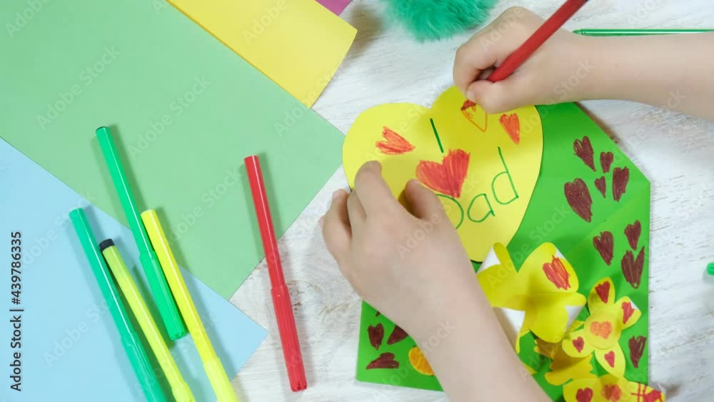 Greeting card for on Father's Day heart with lettering. Envelope crafts and flower from colorful paper. Handmade. Children's creativity project, crafts for kids. DIY concept.
Greeting card for on Father's Day heart with lettering. Envelope crafts and flower from colorful paper. Handmade. Children's creativity project, crafts for kids. DIY concept.