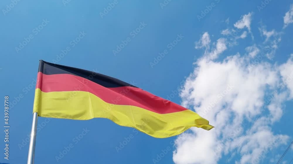 National country flag on blue sky background. Flying fabric symbol. Tourism or travel summer day. international patriotic emblem. Nobody. Horizontal video National country flag on blue sky background. Flying fabric symbol. Tourism or travel summer day. international patriotic emblem. Nobody. Horizontal video