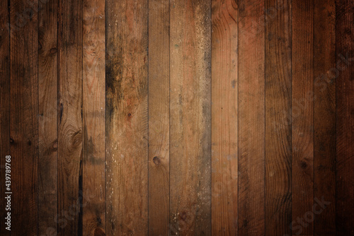 Dark old barn wood background texture. Vintage weathered rough planks backdrop.