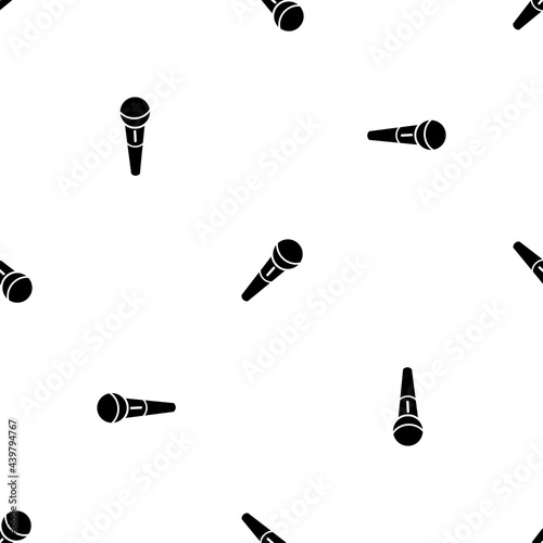 Seamless pattern of repeated black microphone symbols. Elements are evenly spaced and some are rotated. Vector illustration on white background