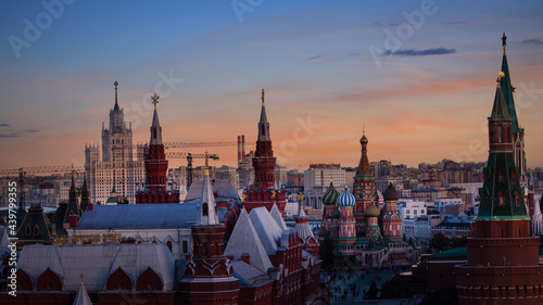 The skyline moscow cityscape with sunset scene , St. Basil's Cathedral and Kremlin Walls and Tower in Red square