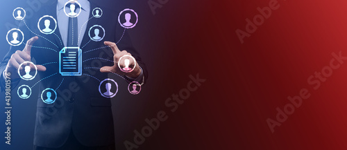 Man hold document and user icon.Corporate data management system (DMS) and document management system concept. Businessman click (or publish) on document connected with corporate users