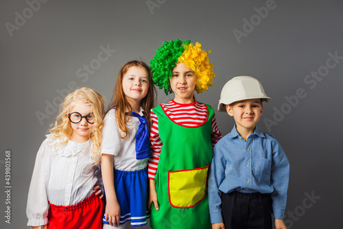 The joyful children in a different professions costumes