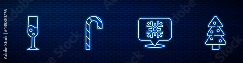 Set line Snowflake speech bubble, Glass of champagne, Christmas candy cane and tree. Glowing neon icon on brick wall. Vector