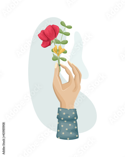 A bouquet of flowers in a woman's hand. Dried flowers, herbarium