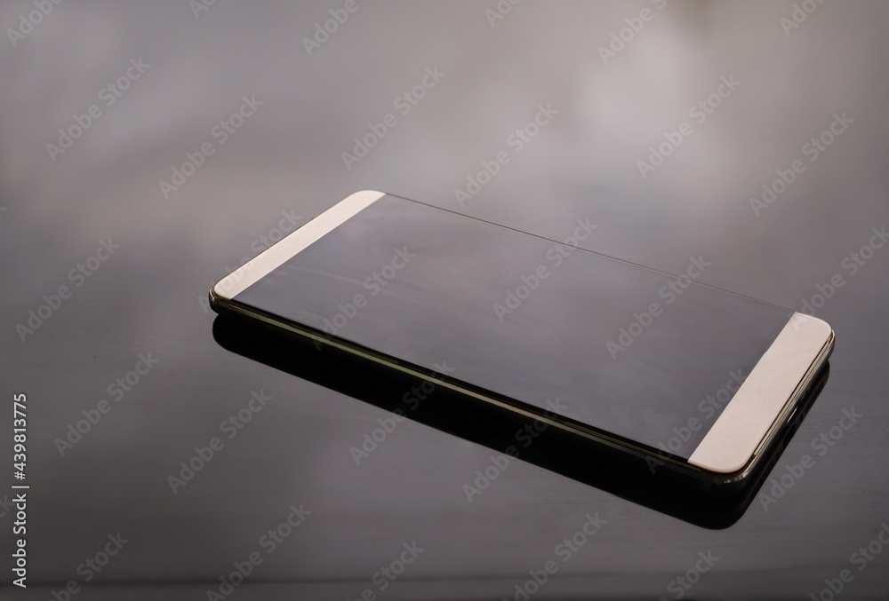 Mobile or smartphone with black glass background. new modern technology digital hi speed internet wirless wifi connection network business concept. Mobile or smartphone with black glass background. new modern technology digital hi speed internet wirless wifi connection network business concept.
