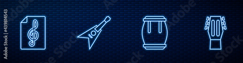 Set line Drum, Treble clef, Electric bass guitar and Guitar. Glowing neon icon on brick wall. Vector
