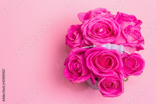 Bouquet of fresh pink roses in a bucket