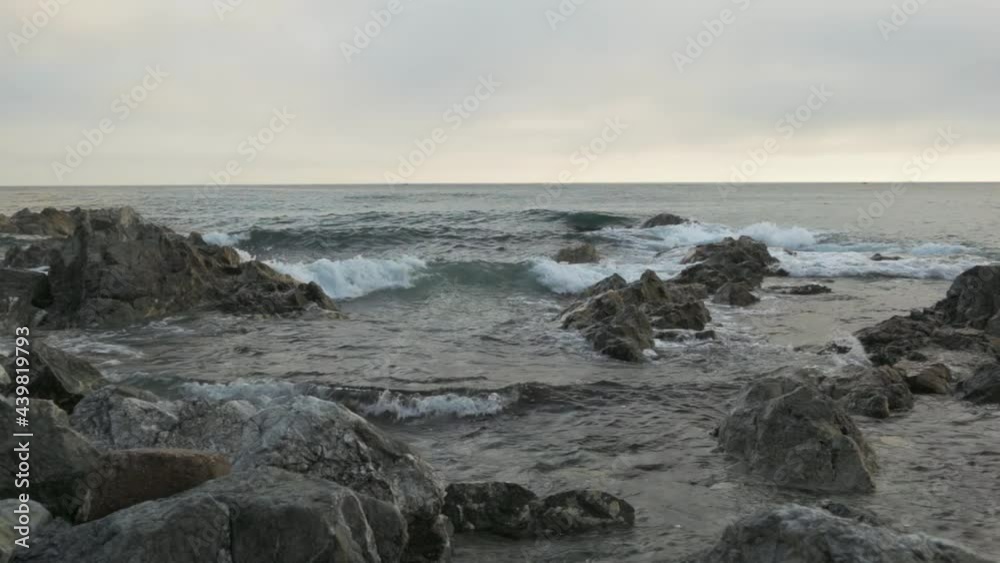 The waves crash on the rocks. Sea coast. The sound of the sea. Summer. The waves crash on the rocks. Sea coast. The sound of the sea. Summer.