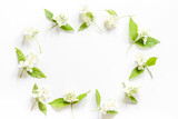 Frame of white jasmine flowers. Top view flat lay
