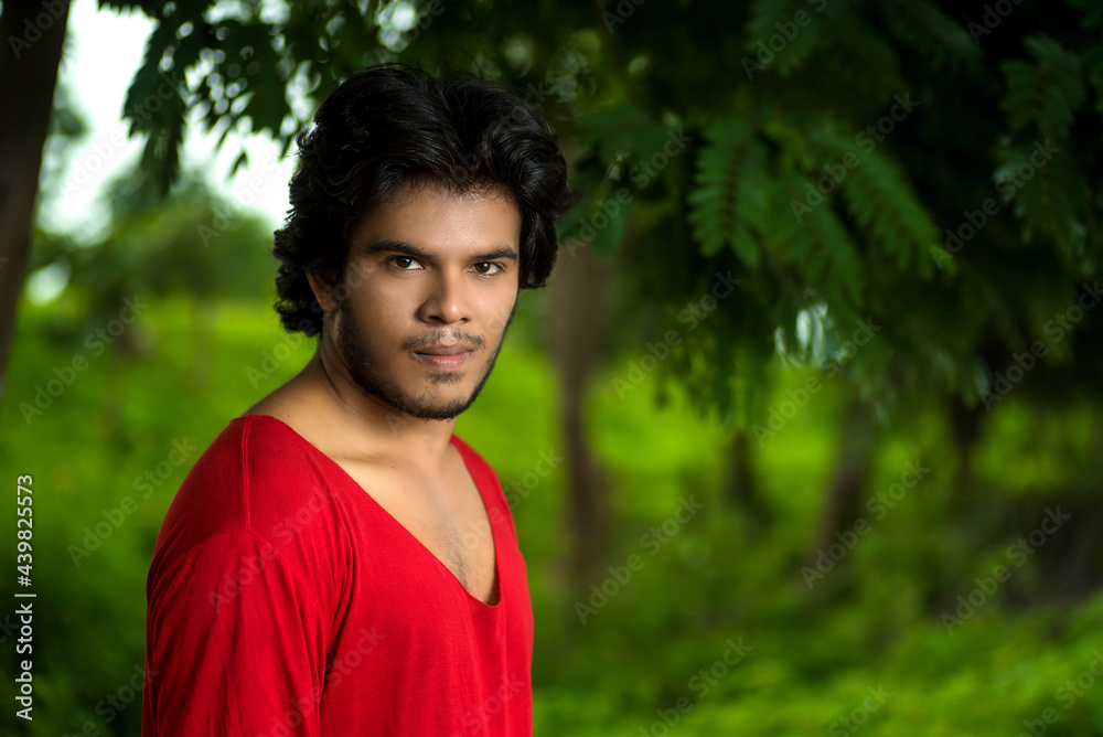 Handsome fashion young man posing outdoors Handsome fashion young man posing outdoors