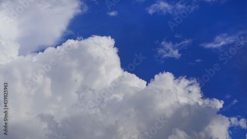 background blue sky with white cumulus clouds texture