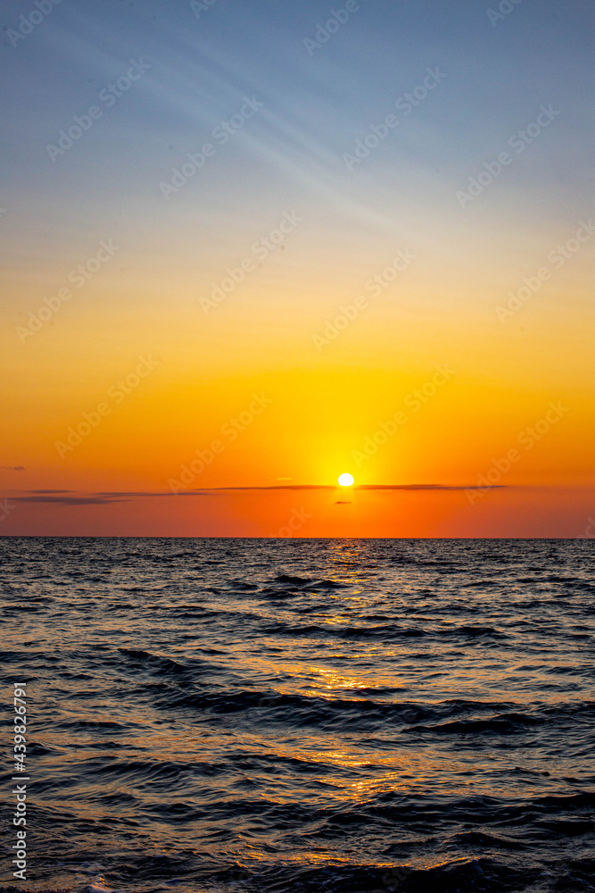 beautiful sunset at sea vertical photo