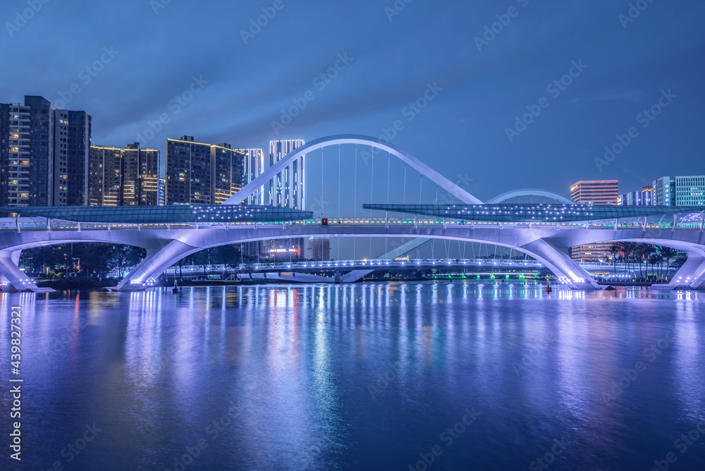 Night view of Jiaomen River pedestrian bridge in Nansha, Guangzhou, China