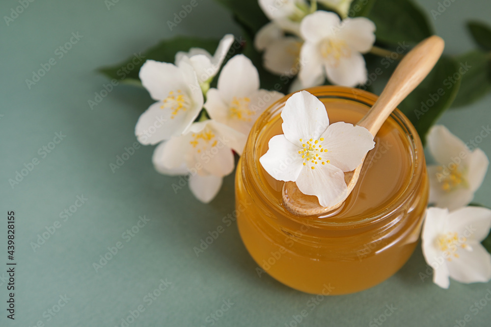 Jasmine honey, Jasmine flowers on green background. Herbal Medicine or Cosmetics. Copy space Jasmine honey, Jasmine flowers on green background. Herbal Medicine or Cosmetics. Copy space