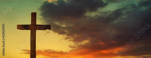 Wooden cross on a sunset background. Wide panoramic view. Artistic work