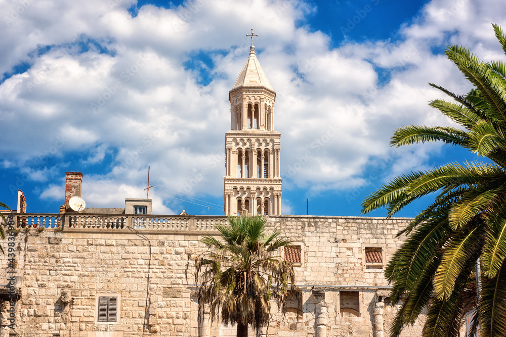 Scenic view of famous Diocletian’s palace at Split old city with bell tower, white fortress wall and blue sky with clouds, stunning architectural landmark, Dalmatia, Croatia, outdoor travel background