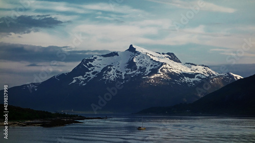 snow covered mountains. Magnificent landscape with snow, iceberg, mountains, sky and sea, Trollfjord, Honningsvag, Norway 