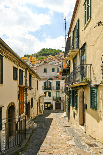 Fototapeta Naklejka Na Ścianę i Meble -  Muro Lucano, Italy, June 12, 2021. A narrow street among the old houses of a medieval village in the Basilicata region.