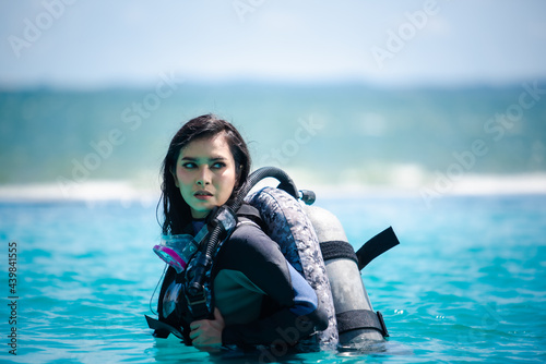 asian woman in scuba diving gear.