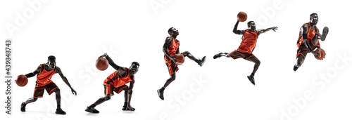 Full length portrait of a basketball player with a ball isolated on white studio background. advertising concept. Fit african athlete jumping with ball. photo