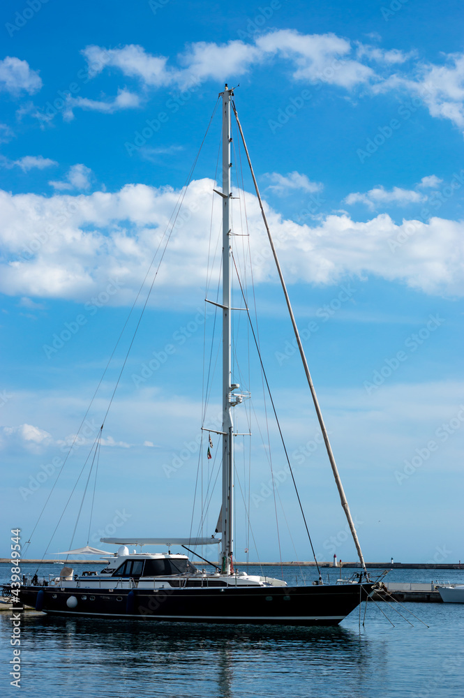 Vertical view boat in a pier, city mediterranean sea