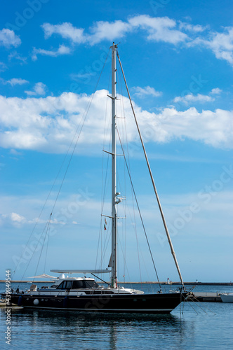 Vertical view boat in a pier, city mediterranean sea