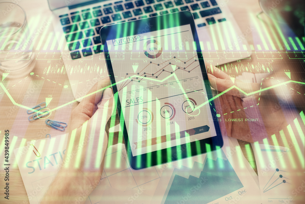 Double exposure of man's hand holding and using a digital device and data theme hologram drawing. Technology concept. Double exposure of man's hand holding and using a digital device and data theme hologram drawing. Technology concept.