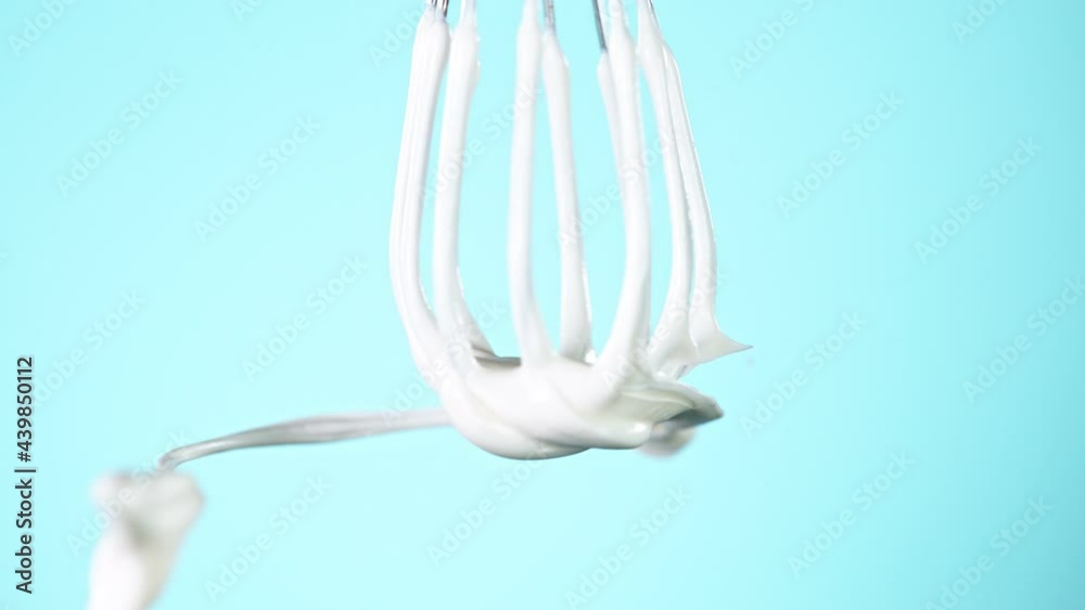 Super slow motion of mixing melted cream with a whisk. Filmed on high speed cinematic camera at 1000 fps. Super slow motion of mixing melted cream with a whisk. Filmed on high speed cinematic camera at 1000 fps.