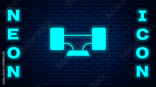 Glowing neon Skateboard wheel icon isolated on brick wall background. Skateboard suspension. Skate wheel. Vector