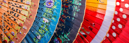 Colorful spanish fans in Andalusia, panoramic Spain backgroun