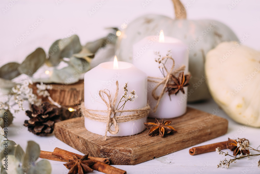 Autumn composition with pumpkin and candles. Beautiful autumn decor Autumn composition with pumpkin and candles. Beautiful autumn decor