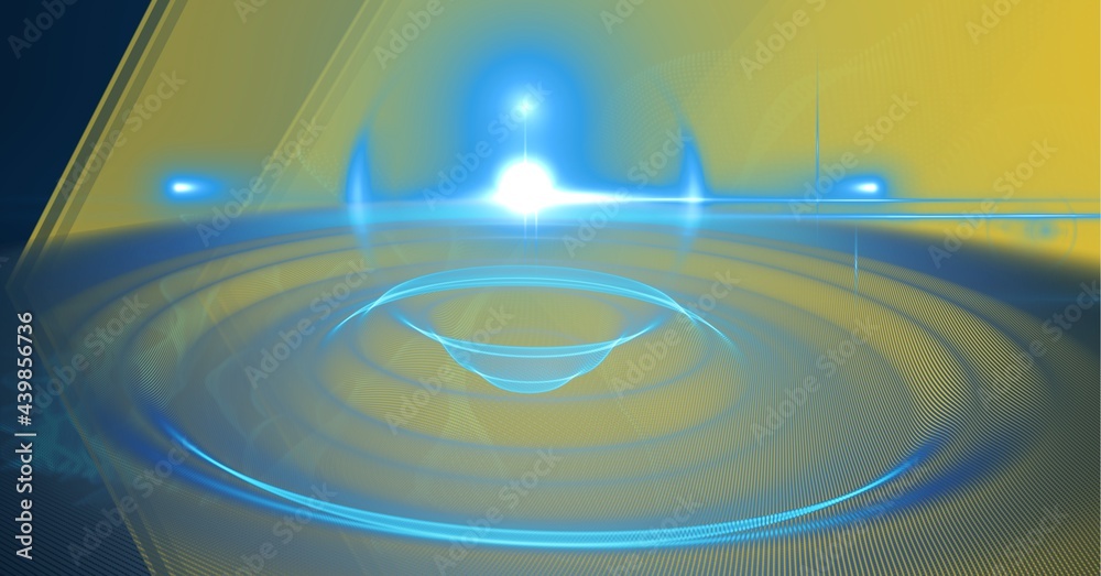 Fototapeta premium Digitally generated image of blue spot of light against yellow technology background