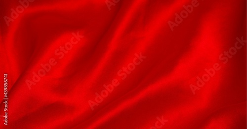 Digitally generated image of waves texture effect against red background