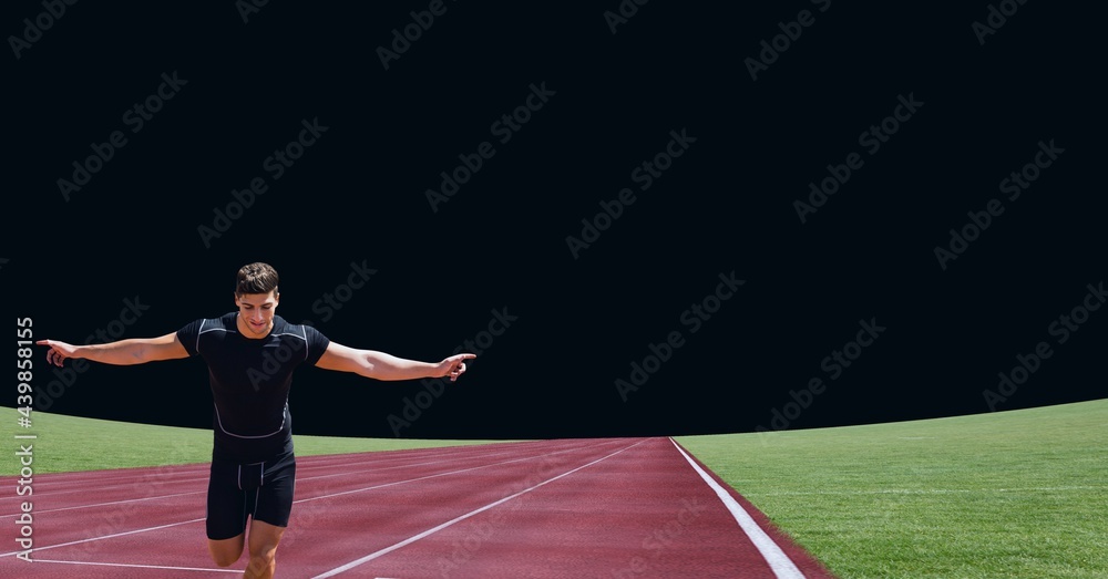 Caucasian male athlete celebrating on sports field against black background