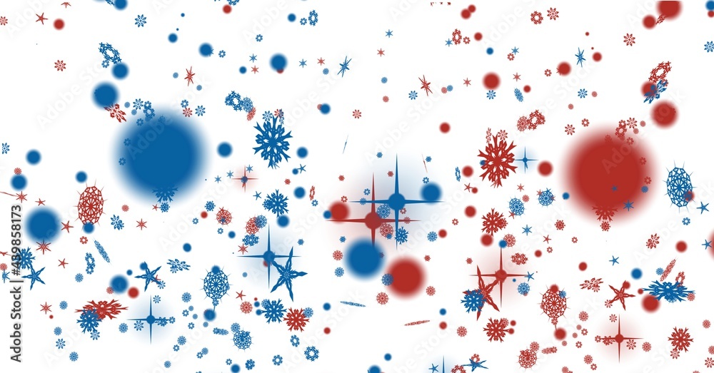 Digitally generated image of blue and red stars and snowflakes against white background