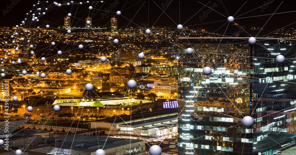 Network of connections against view of cityscape at night