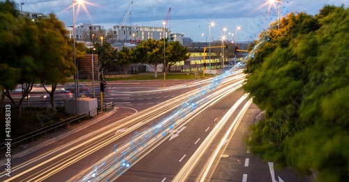 Glowing blue network of connections against view of night city traffic © vectorfusionart