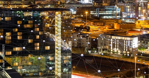 Network of connections against view of cityscape at night