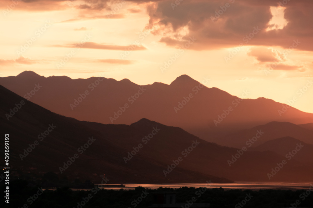 Mountains shape at sunset sky. Relaxing mountain landscape with colorful sunset, nature outdoor travel background.