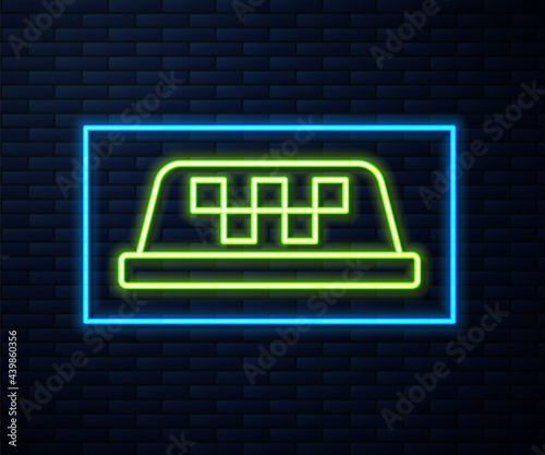 Glowing neon line Taxi car roof icon isolated on brick wall background. Vector