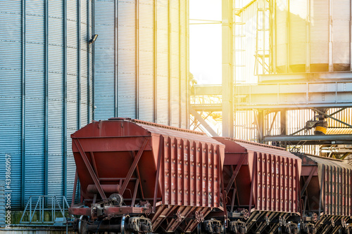 Grain cars being loaded with grain at a grain elevator