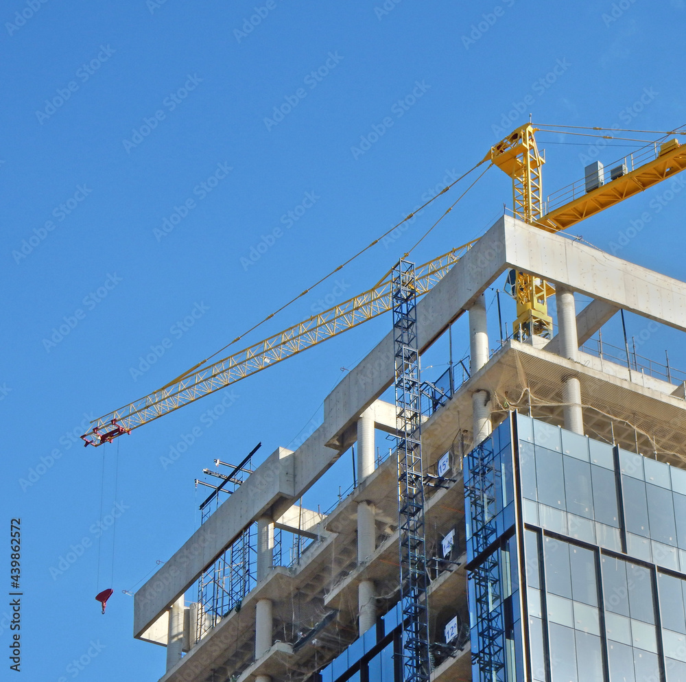 Bulding under construction and crane over floors Bulding under construction and crane over floors