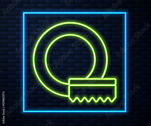 Glowing neon line Washing dishes icon isolated on brick wall background. Cleaning dishes icon. Dishwasher sign. Clean tableware sign. Vector