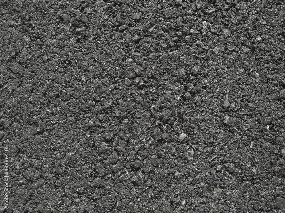 Texture of black street asphalt close-up background. Texture of black street asphalt close-up background.