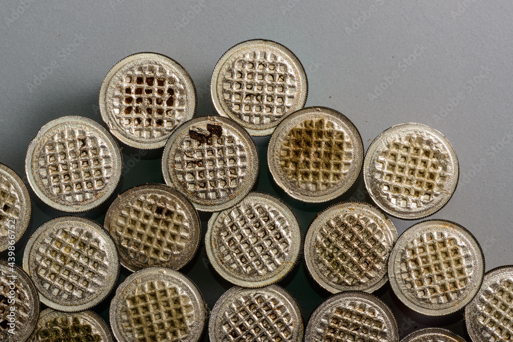 Colored and used coffee capsules in close-up. Colored and used coffee capsules in close-up.