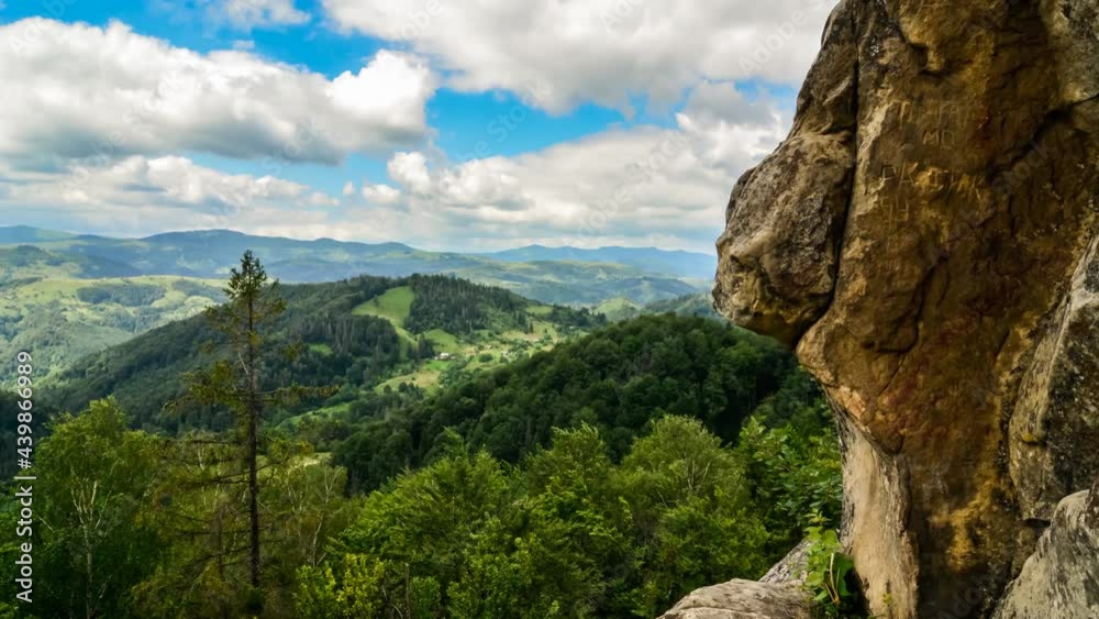 time lapse of clouds moving over woody hills and cliff time lapse of clouds moving over woody hills and cliff