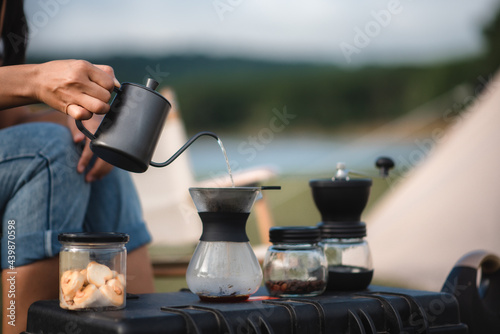camping people Prepare equipment for making drip coffee.