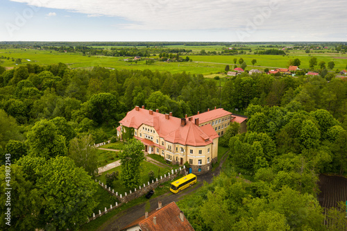 Secondary school in the village of Saranskoye, Kaliningrad region, in the past there was Lauken castle in East Prussia, view from a drone